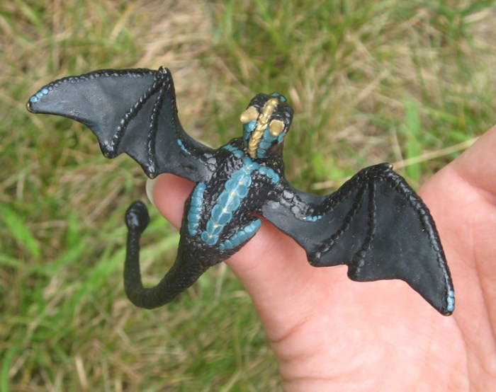 perching_dragon_from_above_by_tallydragon